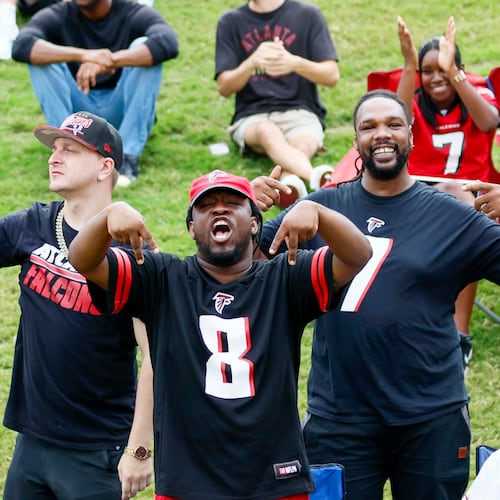 Fans celebrate during the Atlanta Falcons’ joint practice with the Tennessee Titans at the Falcons Practice Facility on Tuesday, Aug. 12, 2025, in Flowery Branch. (Miguel Martinez/AJC)