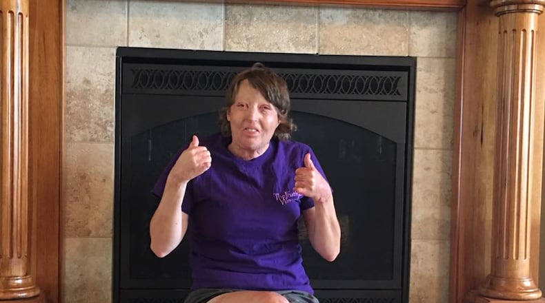 Courtney Waldron gives a thumbs up at her new home. Image: Facebook