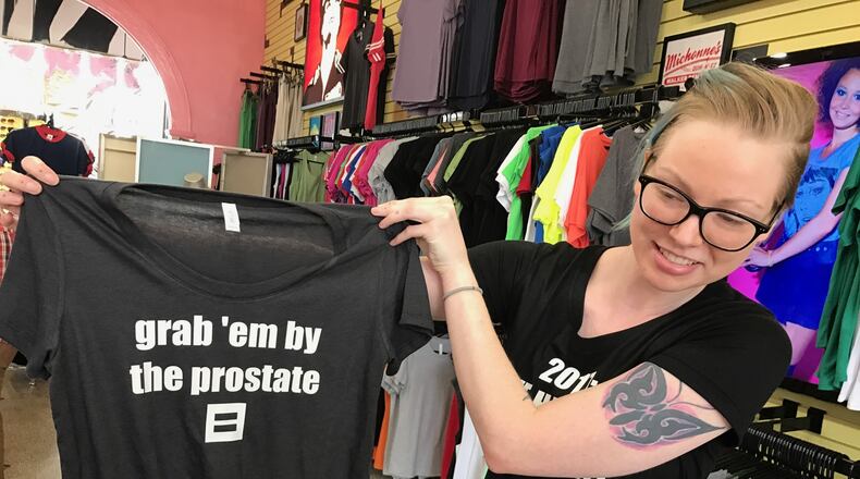 Leah Medley demonstrates popular T-shirt design at Bang-On T-Shirts in Little Five Points. Photo: Bo Emerson