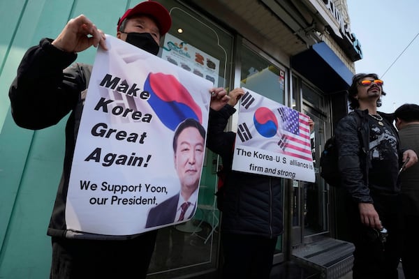 Supporters of impeached South Korean President Yoon Suk Yeol stand against his impeachment near the Constitutional Court in Seoul, South Korea, Tuesday, April 1, 2025. (AP Photo/Ahn Young-joon)