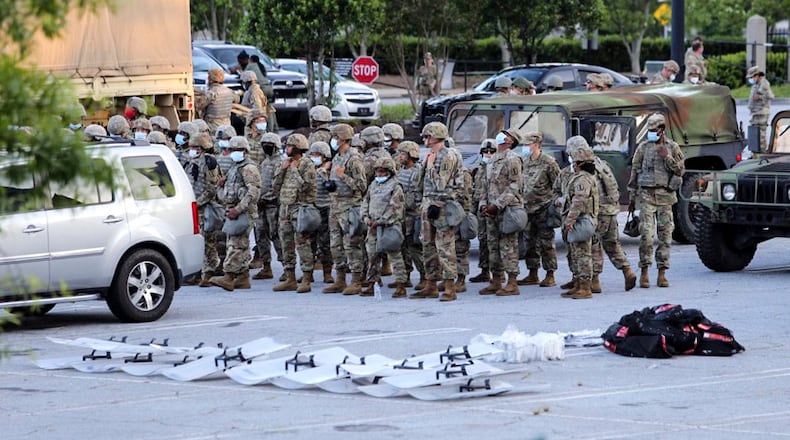 May 30, 2020 - Atlanta - Georgia National Guard units deploy at Lenox Square as protests continued for a second day. Protests over the death of George Floyd in Minneapolis police custody spread around the United States on Saturday, as his case renewed anger about others involving African Americans, police and race relations. Jenni Girtman for the Atlanta Journal Constitution
