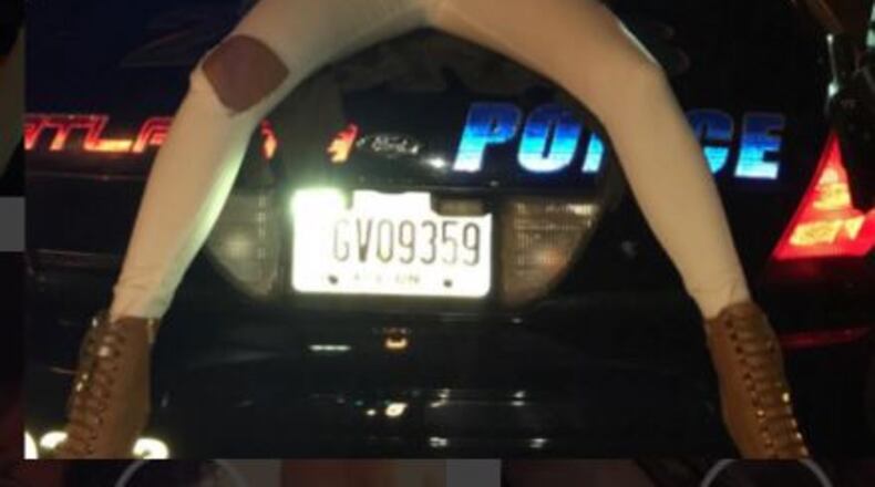 A woman sits on an Atlanta police car in an Instagram photo. (Credit: Instagram)