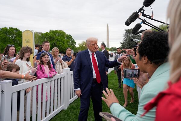 President Donald Trump greets people during the White House Easter Egg Roll on the South Lawn of the White House, Monday, April 21, 2025, in Washington. (AP Photo/Alex Brandon)