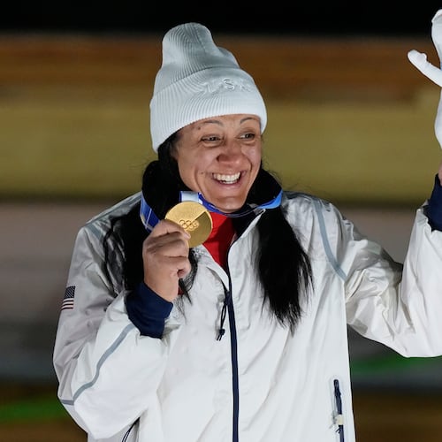 United States' gold medalist Elana Meyers Taylor poses on the podium after the women's monobob competition at the 2026 Winter Olympics, in Cortina d'Ampezzo, Italy, Monday, Feb. 16, 2026. (Aijaz Rahi/AP)