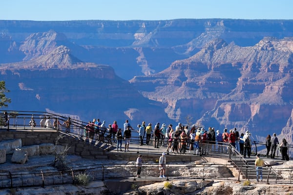 Tourists enjoyed the view at Grand Canyon National Park in Arizona in October. (Ross D. Franklin/AP)
