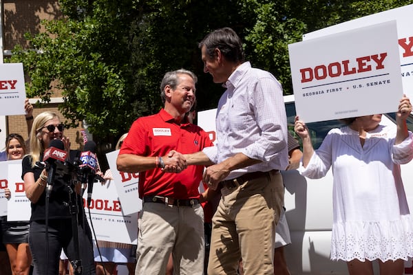 Gov. Brian Kemp (left) greets Derek Dooley at a campaign stop in Athens on Saturday, Aug. 30, 2025. (Jason Getz/AJC)