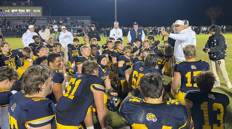 Prince Avenue Christian head coach Greg Vandagriff talks with his players after the team's 41-7 victory over Irwin County in the Class A Division I quarterfinals in Bogart on Nov. 24, 2023