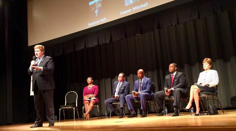 Former Atlanta Chief Operating Officer Peter Aman (left) addresses the crowd at a mayoral forum held by the Council for Quality Growth, Thursday, Sept. 13, 2017. City Councilwoman Keisha Lance Bottoms (second from left), former Fulton County Commission Chairman John Eaves, Atlanta City Councilman Kwanza Hall, Atlanta City Council President Ceasar Mitchell and City Councilwoman Mary Norwood also attended. J. SCOTT TRUBEY/STRUBEY@AJC.COM