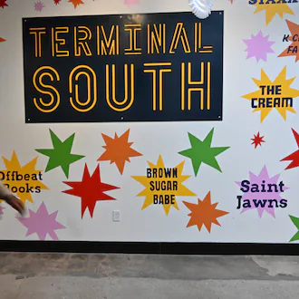 Terminal South, a mixed-use development in Peoplestown that opened earlier this year, includes retail businesses and a food hall called Switchman Hall. Switchman Hall was supposed to open in 2024 but kept getting pushed back as vendors struggled with delays with permitting and the time it takes to build restaurant infrastructure from scratch, an official with the developer said. (Hyosub Shin/AJC)