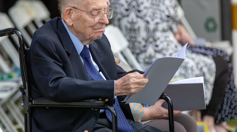 Manning Pattillo, a former Oglethorpe University president, was 102 years old when photographed waiting for the start of the Class of 2022 commencement ceremony. Pattillo helped stabilized the university during his tenure and remained active in supporting it and in many community affairs after his retirement. He died earlier this month. (Steve Schaefer / steve.schaefer@ajc.com)