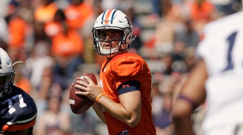FILE - In this April 8, 2017, file photo, Auburn quarterback Jarrett Stidham looks for a receiver during Auburn's NCAA college football spring game in Auburn, Ala. Stidham, who began his college career at Baylor, went 16 of 20 for 267 yards in the spring game. (AP Photo/Todd J. Van Emst, File)