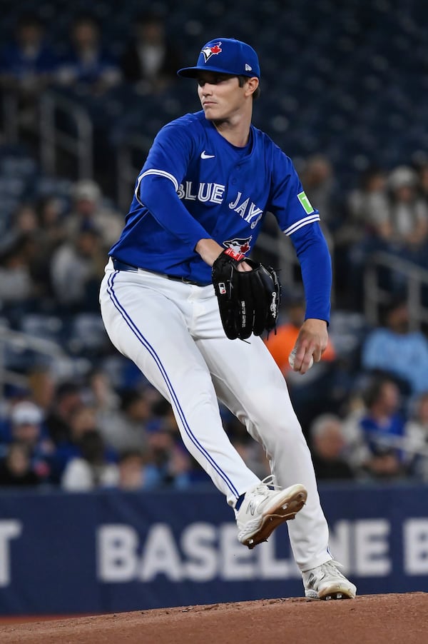 Toronto Blue Jays Starting pitcher Easton Lucas winds up to throw to an Atlanta Braves batter in first-inning baseball game action in Toronto, Monday, April 14, 2025. (on Blacker/The Canadian Press via AP)