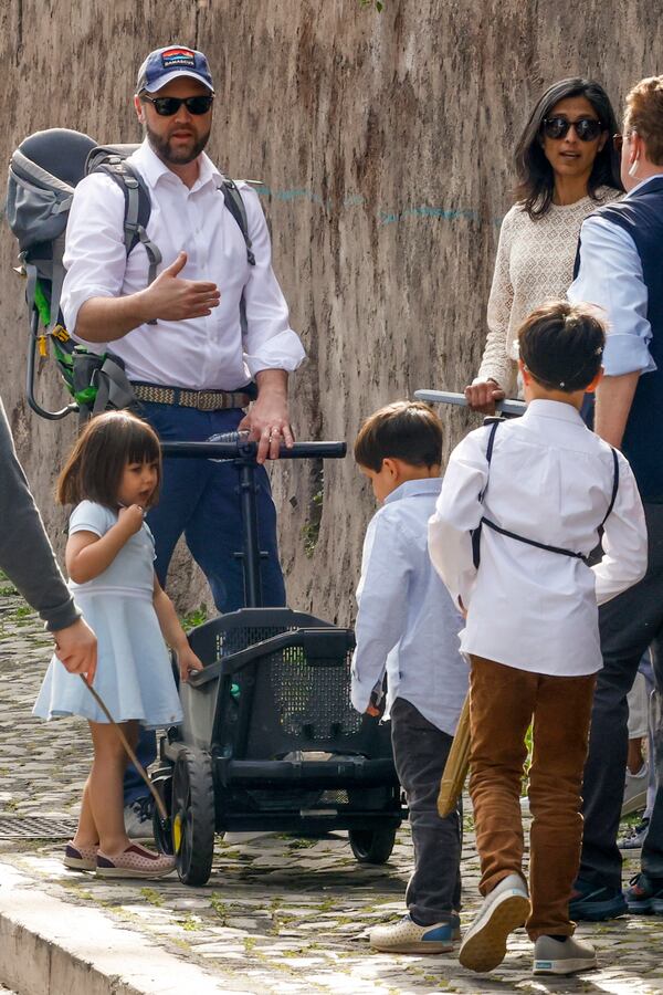 US Vice President J.D. Vance leaves Rome's Botanic Gardens with his wife Usha, right, their daughter Mirabel, left, and sons Vivek and Ewan, back to camera, Saturday, April 19, 2025. (AP Photo/Riccardo De Luca)