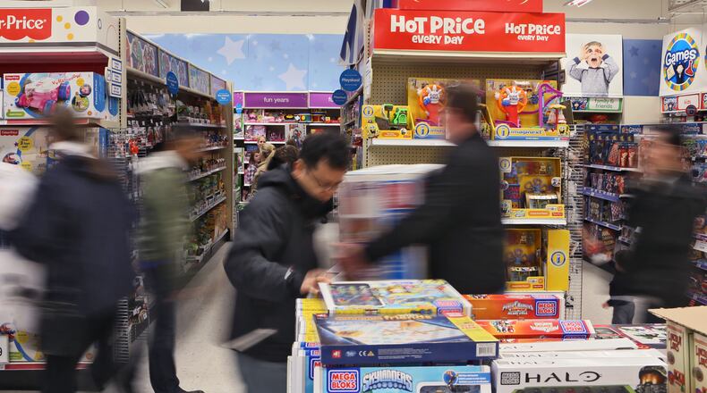 November 27, 2014 - Shoppers scamper for deals at Toy's "R" Us in Alpharetta. Black Friday shoppers got a head start with many stores opening on Thanksgiving evening. BOB ANDRES / BANDRES@AJC.COM