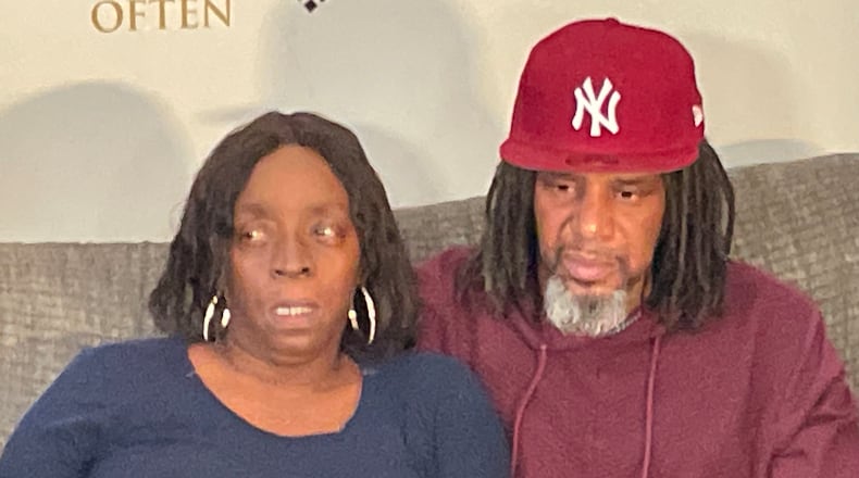 Erik Hinton (right) and Natosha Hinton (left), the parents of 16-year-old Justin Solomon Powell, speak to reporters on Monday, December 19, 2022, in Atlanta. Powell was killed over the weekend. MARIANO WILLOUGHBY FOR THE ATLANTA JOURNAL-CONSTITUTION.