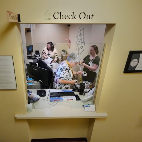 Employees at Ammonoosuc Community Health Services pack up the reception office as the clinic closes for good, Thursday, Oct. 23, 2025, in Franconia, N.H. (AP Photo/Robert F. Bukaty)