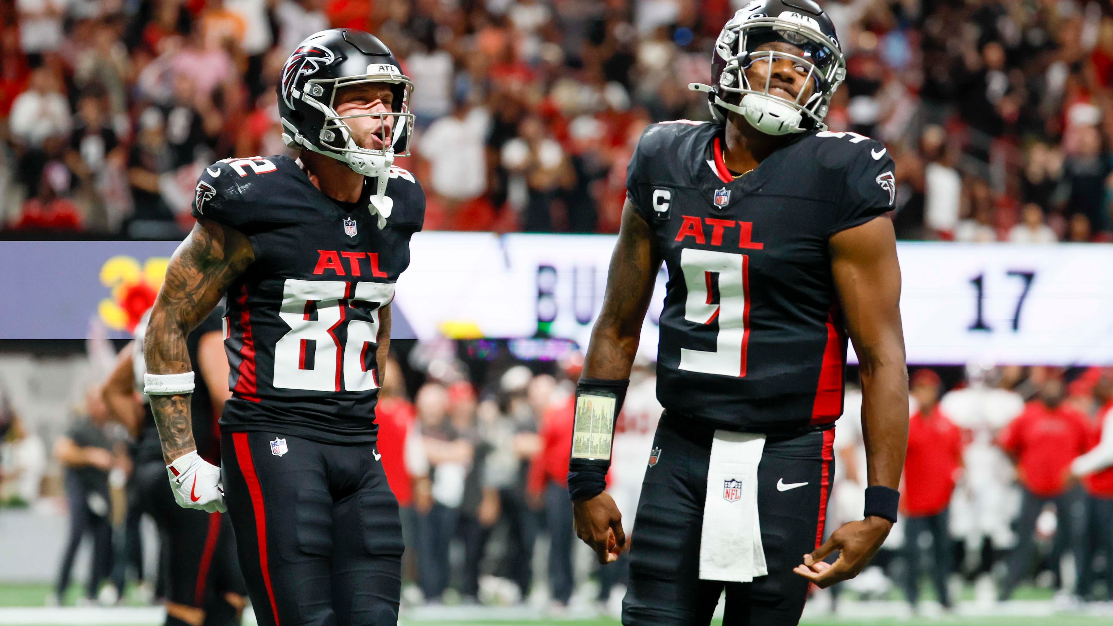 Atlanta Falcons wide receiver Casey Washington (left) celebrates with quarterback Michael Penix Jr.after his touchdown during the second half Sunday. 
There was no celebrating at the end,however, when Atlanta lost. (Miguel Martinez/AJC)