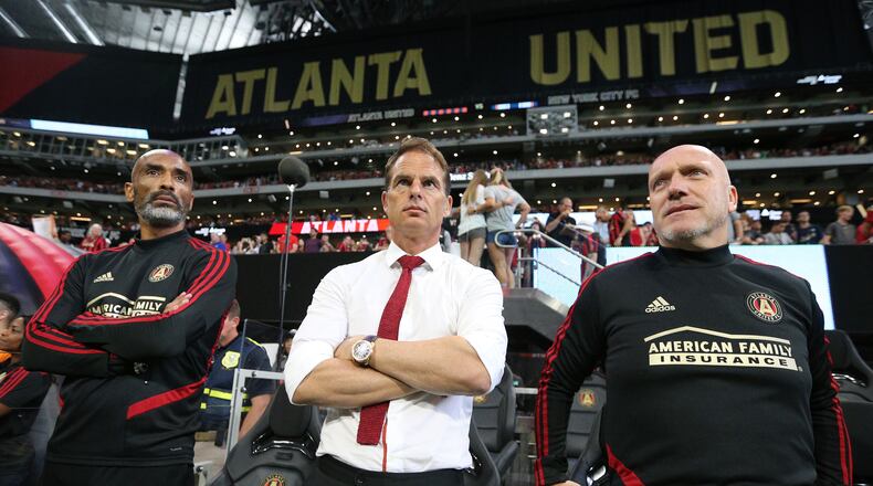 August 11, 2019 Atlanta: Atlanta United head coach Frank de Boer (center) and assistant coaches Orlando Trustfull (left) and Bob de Klerk lead the team in a 2-1 victory over New York City FC in their soccer match on Sunday, August 11, 2019, in Atlanta. Curtis Compton/ccompton@ajc.com
