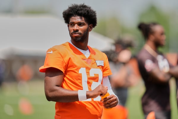Cleveland Browns quarterback Shedeur Sanders (12) takes a break during NFL football practice in Berea, Ohio, Wednesday, June 4, 2025. (AP Photo/Sue Ogrocki)