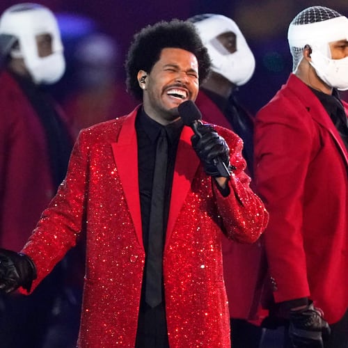 FILE - The Weeknd performs during the halftime show of the NFL Super Bowl 55 football game between the Kansas City Chiefs and Tampa Bay Buccaneers, on Feb. 7, 2021, in Tampa, Fla. (AP Photo/Ashley Landis, File)