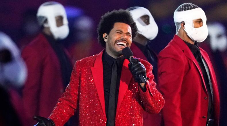 FILE - The Weeknd performs during the halftime show of the NFL Super Bowl 55 football game between the Kansas City Chiefs and Tampa Bay Buccaneers, on Feb. 7, 2021, in Tampa, Fla. (AP Photo/Ashley Landis, File)