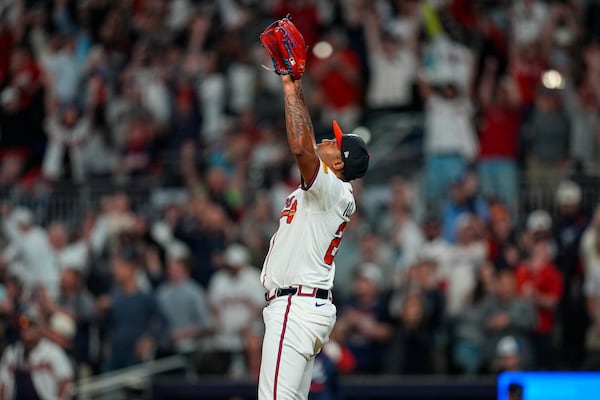 Braves closer Raisel Iglesias celebrates Sunday's win over the Dodgers. (Mike Stewart/AP)