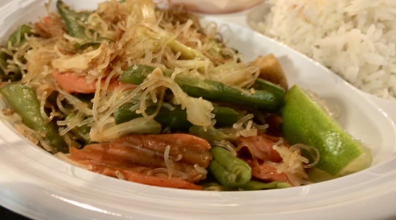 Casual, no-frills Decatur restaurant Janet’s Kitchen has a small menu of traditional Filipino entrees. Pictured is vegetable pancit, a dish of rice noodles with cabbage, baby corn, snow peas and other veggies, a serving of white rice and a side order of mango salad. LIGAYA FIGUERAS / LFIGUERAS@AJC.COM