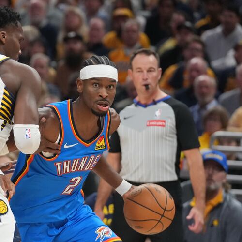 Oklahoma City Thunder's Shai Gilgeous-Alexander (2) is defended by Indiana Pacers' Bennedict Mathurin (00) during the first half of an NBA basketball game, Thursday, Oct. 23, 2025, in Indianapolis. (AP Photo/Darron Cummings)