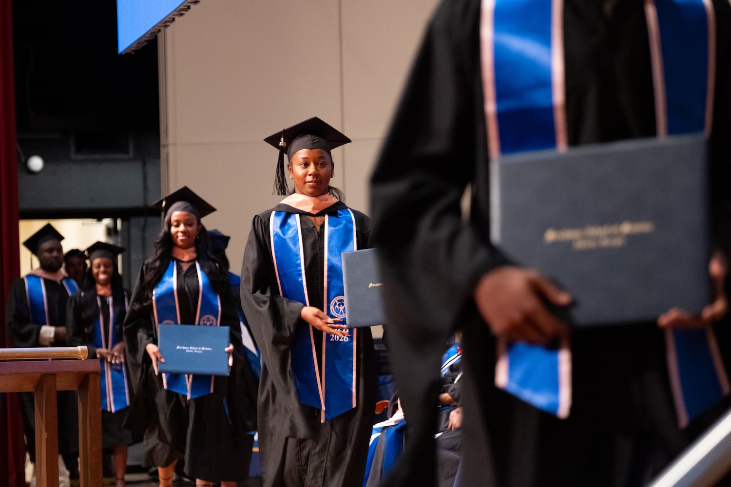 Masters of Public Health students cross the stage after receiving their degrees during the graduation ceremony for Morehouse School of Medicine on Saturday, May 16, 2026, in Atlanta. (Ben Gray for the AJC)