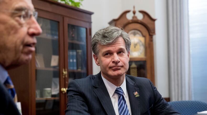 Sen. Chuck Grassley, R-Iowa, left, accompanied by FBI Director nominee Christopher Wray, right, speaks to members of the media in his office on Capitol Hill in Washington, Thursday, June 29, 2017. (AP Photo/Andrew Harnik)
