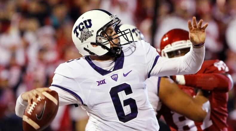 FILE - In this Nov. 21, 2015, file photo, TCU quarterback Bram Kohlhausen (6) passes against Oklahoma during the fourth quarter of an NCAA college football game in Norman, Okla. The Horned Frogs know all about playing a third-string quarterback. With star Trevone Boykin (ankle) out last week, TCU used two of his backups _ Bram Kohlhausen and Foster Sawyer _ and still nearly beat the Soonetrs in Norman. (AP Photo/Alonzo Adams, File)