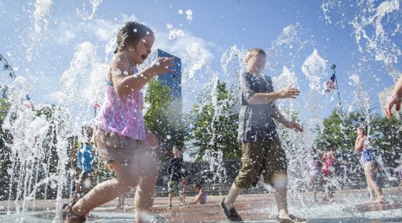 Children play in the Fountain of Rings at Centennial Olympic Park, one of the many tourist attractions in the city’s 5th District.