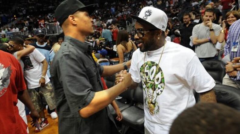 090509 Atlanta -- T.I. (left) and Jermaine Dupri greet before game 3 between Atlanta Hawks vs. Cleveland Cavaliers at Philips Arena in Atlanta Saturday, May 9, 2009 HYOSUB SHIN / hshin@ajc.com