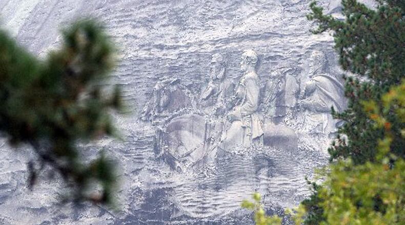 Stone Mountain, which is adorned with a huge carving depicting Confederate heroes, is classified as a Confederate memorial by state statute. KENT D. JOHNSON/AJC