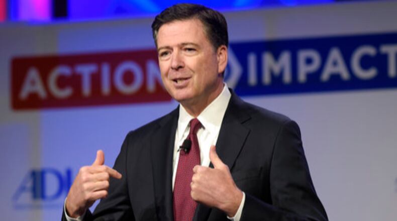 FILE - In this May 8, 2017, file photo, then-FBI Director James Comey speaks to the Anti-Defamation League National Leadership Summit in Washington. The White House is disputing a report that President Donald Trump asked Comey to shut down an investigation into ousted national security adviser Michael Flynn. (AP Photo/Susan Walsh, File)