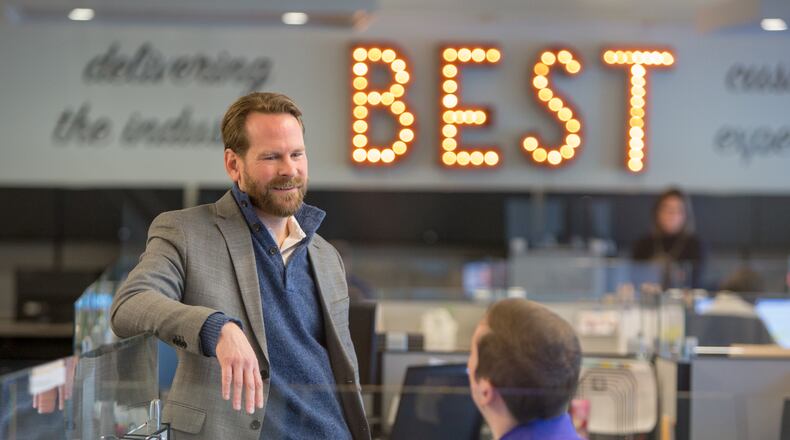 David Queen (left) & Eric Dahle chat at the Supreme Lending offices in Alpharetta on January 26th, 2018. For story in the AJC Top Workplaces section.  (Photo by Phil Skinner)