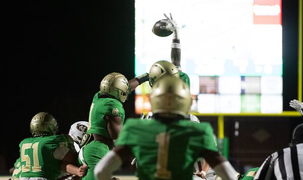 Buford blocks a field goal at the Buford/Mill Creek football game(Photo Jamie Spaar for The Atlanta Journal-Constitution)