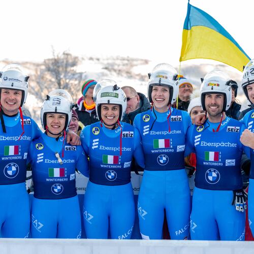 The Italian relay team with Verena Hofer, Ivan Nagler, Fabian Malleier, Dominik Fischnaller, Andrea Voetter and Marion Oberhofer celebrate their third place at the mixed relay competition of the Luge World Cup in Winterberg, Germany, Sunday Jan. 11, 2026. (David Inderlied/dpa via AP)