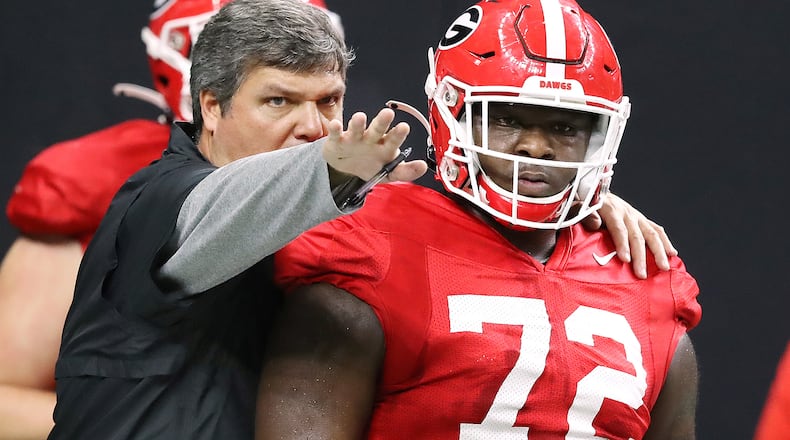 New Georgia offensive line coach Matt Luke works with offensive lineman Netori Johnson during team practice Sunday, Dec. 29, 2019, at Mercedes-Benz Superdome in New Orleans ahead of their Sugar Bowl matchup against the Baylor Bears.