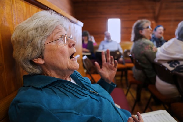 Chris Wilhelm of Black Mountain, N.C., participates in a Sacred Harp singing at Holly Springs Primitive Baptist Church in Bremen, Ga., on Saturday, March 22, 2025. (AP Photo/Jessie Wardarski)