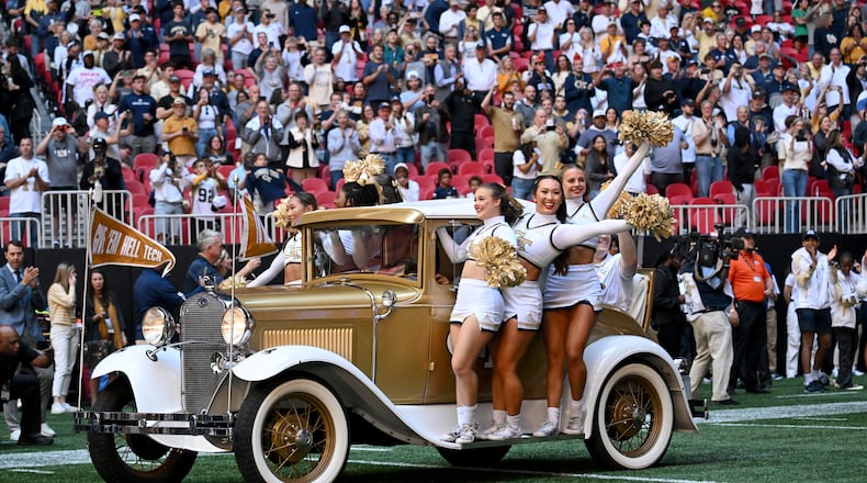 Georgia Tech's Ramblin' Wreck leads players and coaches before the start of an NCAA football game against Notre Dame at Mercedes-Benz Stadium, Saturday, October 19, 2024, in Atlanta. Notre Dame won 31-13 over Georgia Tech. (Hyosub Shin / AJC)