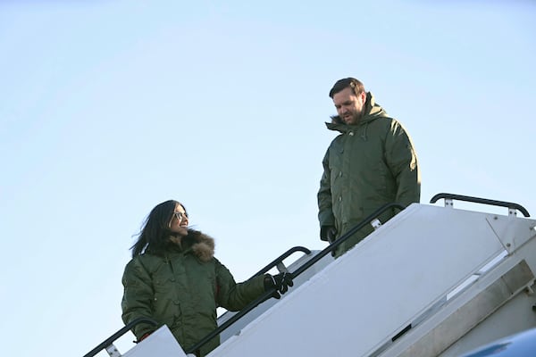 Vice President JD Vance, right, and second lady Usha Vance arrive at Pituffik Space Base in Greenland, Friday, March 28, 2025. (Jim Watson/Pool via AP)