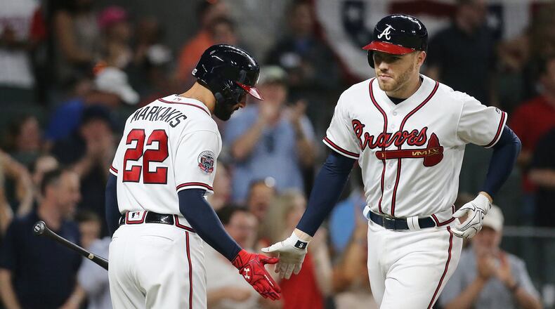 Freddie Freeman hit this third-inning home run Wednesday against the Nationals to break the Atlanta Braves franchise record by reaching base for the 12th consecutive plate appearance. (Curtis Compton/ccompton@ajc.com)
