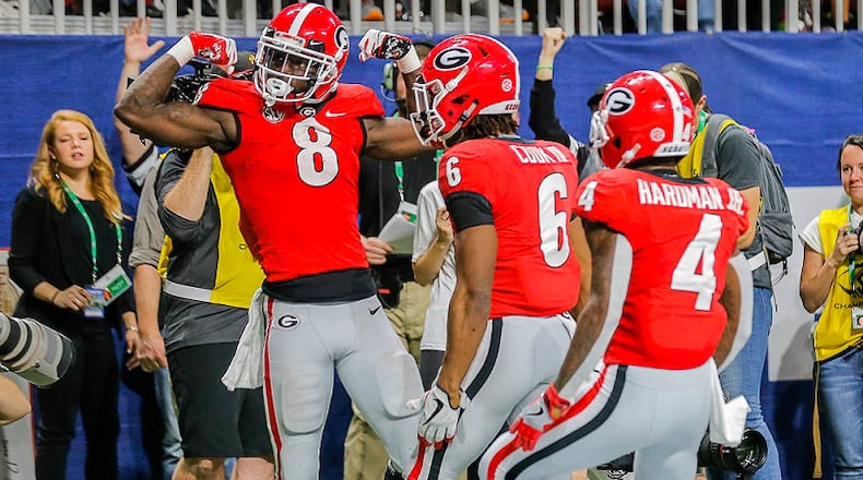 Georgia wide receiver Riley Ridley (8) celebrates after scoring a touchdown during the SEC Championship game at Mercedes-Benz Stadium in Atlanta, Saturday, December 1, 2018. (ALYSSA POINTER/ALYSSA.POINTER@AJC.COM)