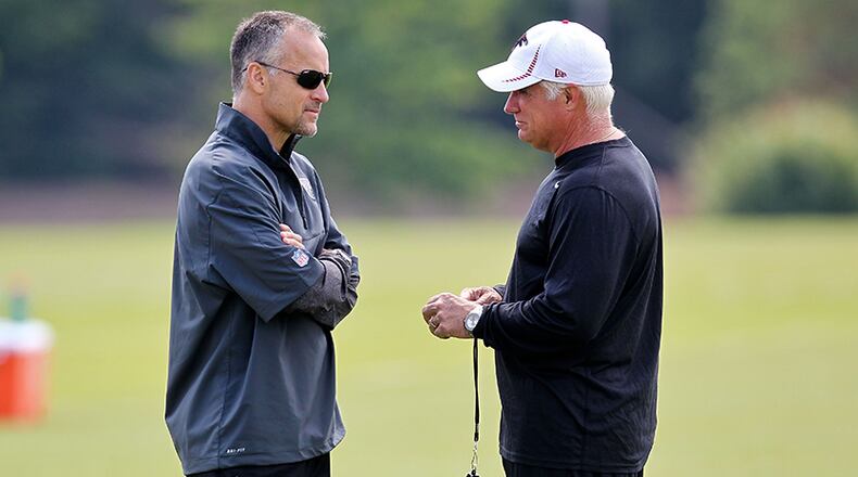 FLOWERY BRANCH, GA - MAY 12: Defensive coordinator Mike Nolan talks to head coach Mike Smith of the Atlanta Falcons during the rookie minicamp at the Atlanta Falcons Training Facility on May 12, 2012 in Flowery Branch, Georgia. (Photo by Daniel Shirey/Getty Images) Mike Nolan (left) and Mike Smith apparently have different views on Smith's fourth-down decision. (Daniel Shirey/Getty Images)