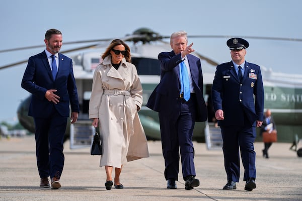 President Donald Trump and first lady Melania Trump walk to board Air Force One for a trip to attend the funeral of Pope Francis, Friday, April 25, 2025, at Andrews Air Force Base, Md. (AP Photo/Evan Vucci)