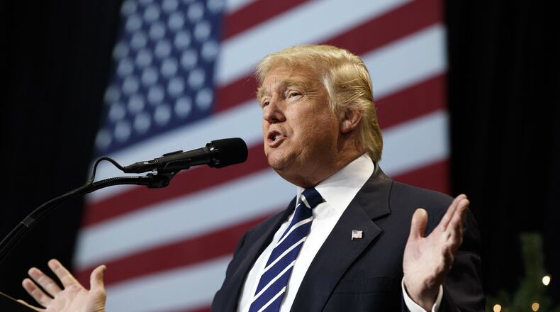 In this Dec. 13, 2016, photo, President-elect Donald Trump speaks during a rally at the Wisconsin State Fair Exposition Center in West Allis, Wisc. (AP Photo/Evan Vucci)