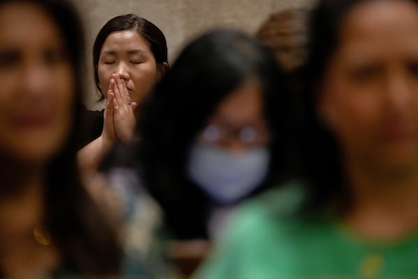 A parishioner prays during a memorial mass for the late Pope Francis at St. Patrick's Cathedral, Saturday, April 26, 2025, in New York. (AP Photo/Julia Demaree Nikhinson)