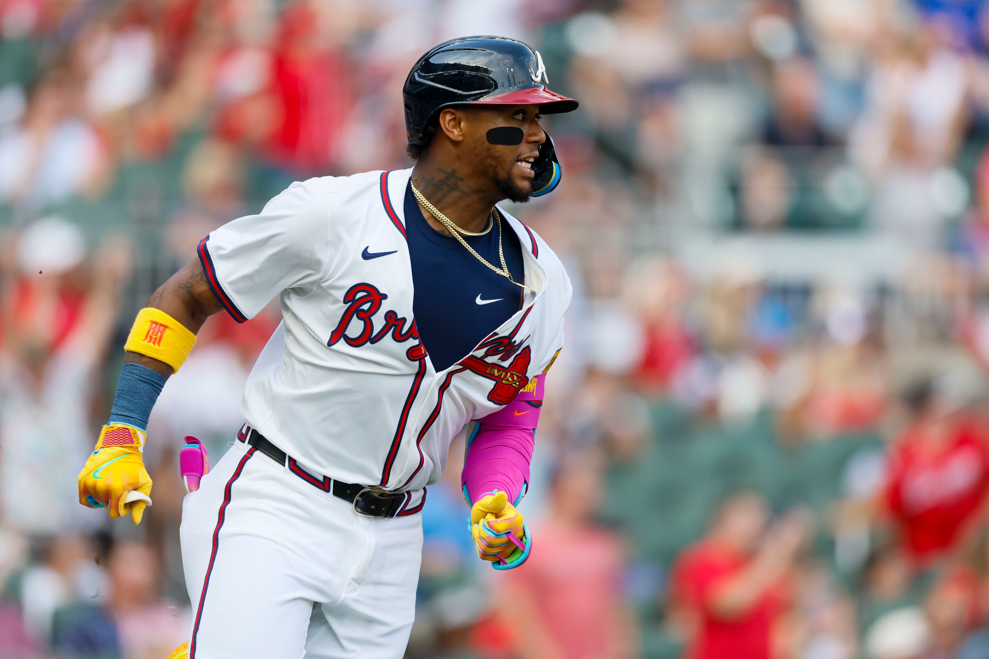 Atlanta Braves' Ronald Acuña Jr. (13) watches the ball after hitting a double during the fifth inning of a baseball game against the San Diego Padres on Sunday, May 25, 2025, in Atlanta. (Miguel Martinez/Atlanta Journal-Constitution via AP)