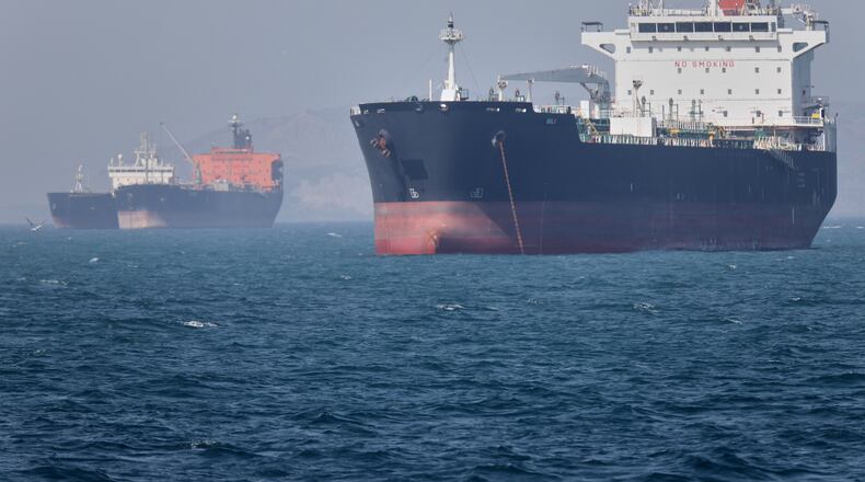 Oil tankers sit at anchor offshore in the Strait of Hormuz off Bandar Abbas, Iran, Saturday, May 2, 2026. (Amirhosein Khorgooi/ISNA via AP)